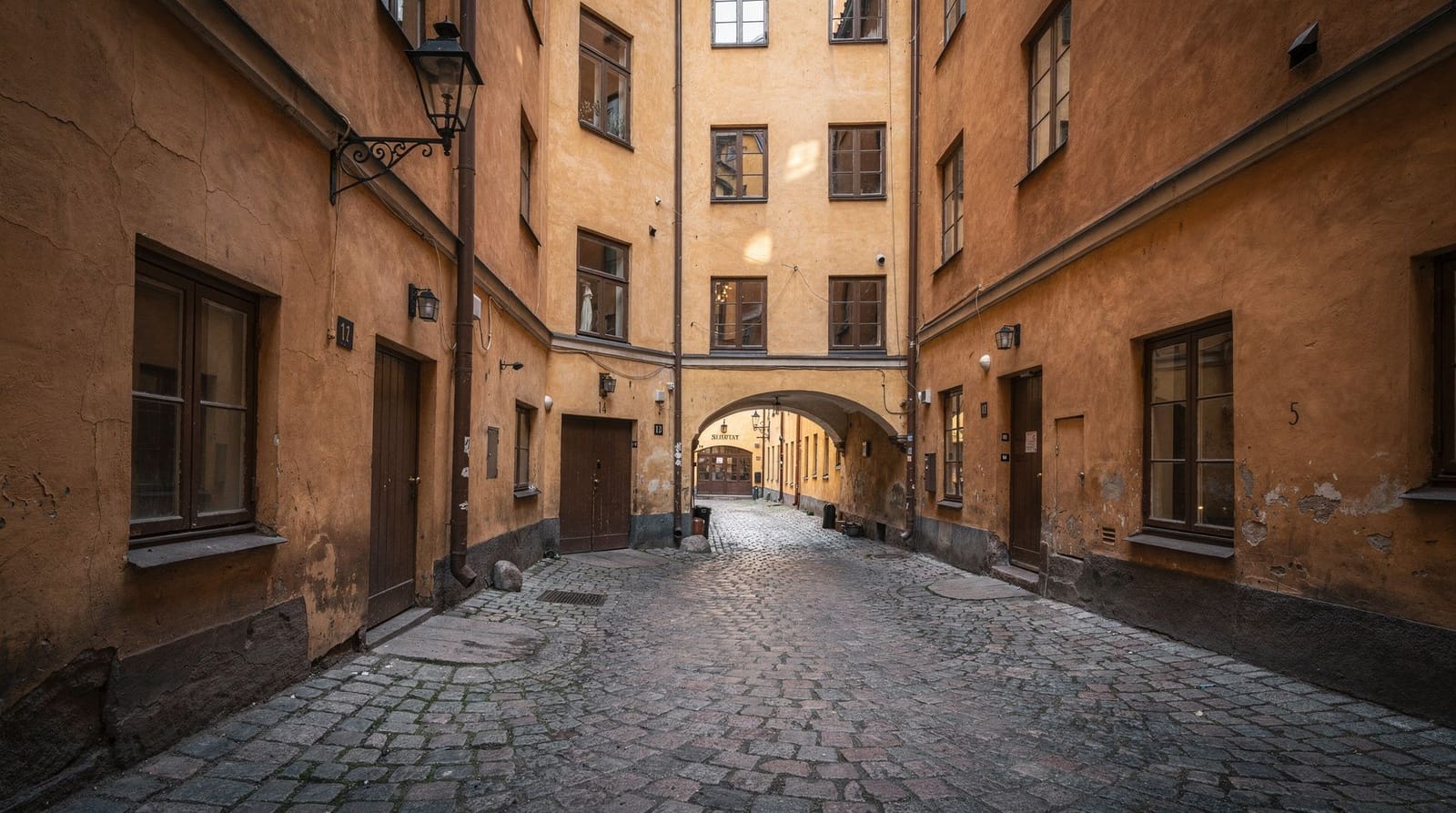 Gamla Stan medieval secrets: hidden history of Stockholm's Old Town — Hidden history of Gamla Stan — Mårten Trotzigs Gränd (90 cm), plague burial site